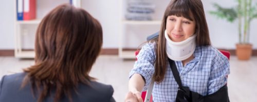 Injured woman seeking legal advice from a personal injury attorney