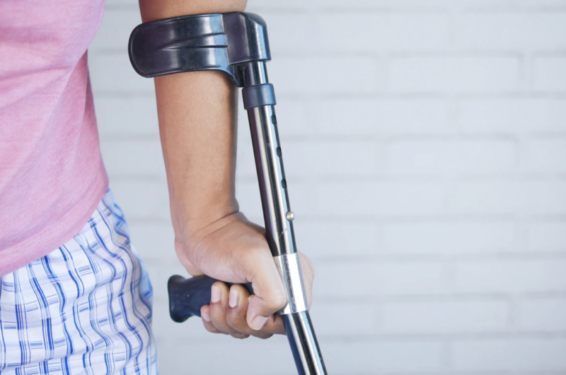 Woman with forearm crutches after personal injury