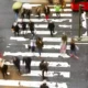 Aerial view of pedestrians walking through crosswalk